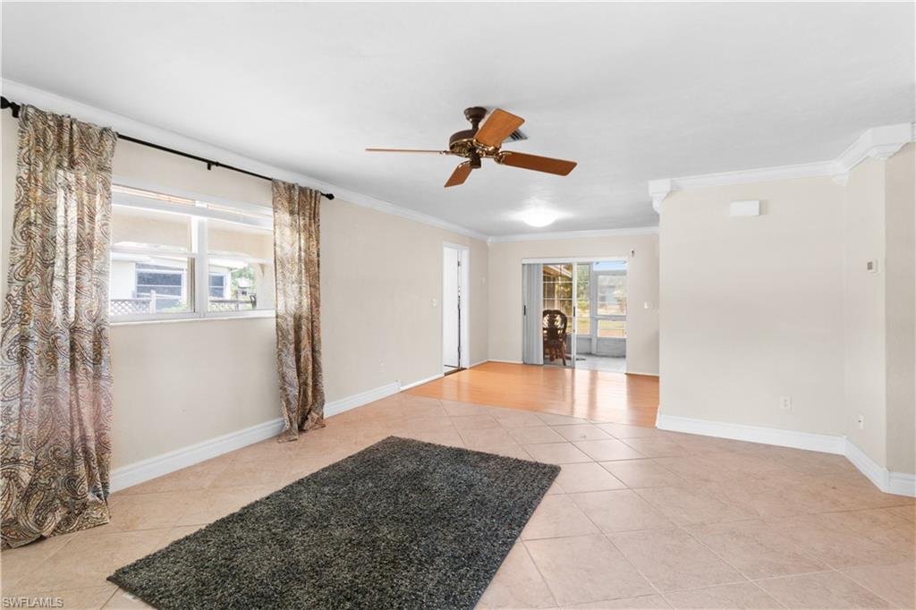 7225 Jasmine Road Fort Myers, FL 33967 - Photo 4 of 24 a view of empty room with wooden floor and windows