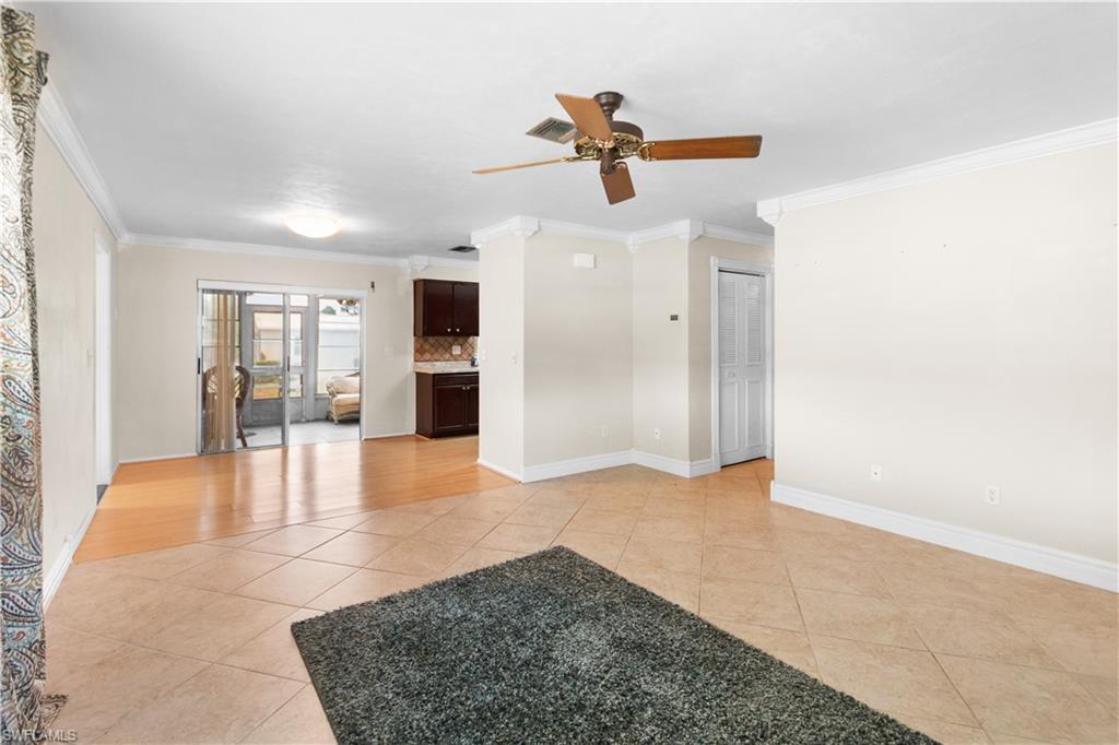 7225 Jasmine Road Fort Myers, FL 33967 - Photo 5 of 24 a view of an empty room with a ceiling fan