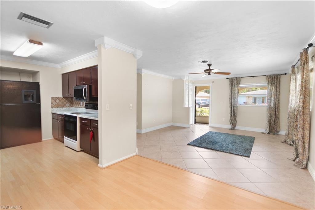 7225 Jasmine Road Fort Myers, FL 33967 - Photo 6 of 24 a kitchen with stainless steel appliances granite countertop a refrigerator and a sink