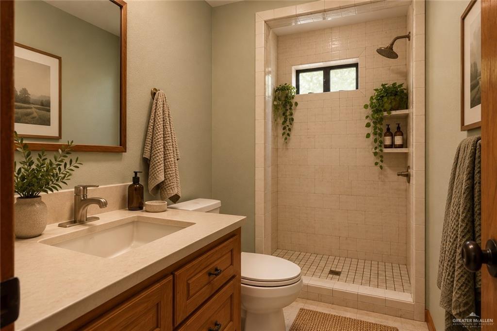 401 West Alberta Road Edinburg, TX 78539 - Photo 20 of 21 Shower enclosure with tiled walls and a small integrated window