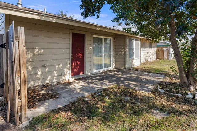 a view of a house with a tree