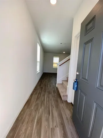 a view of entryway with wooden floor