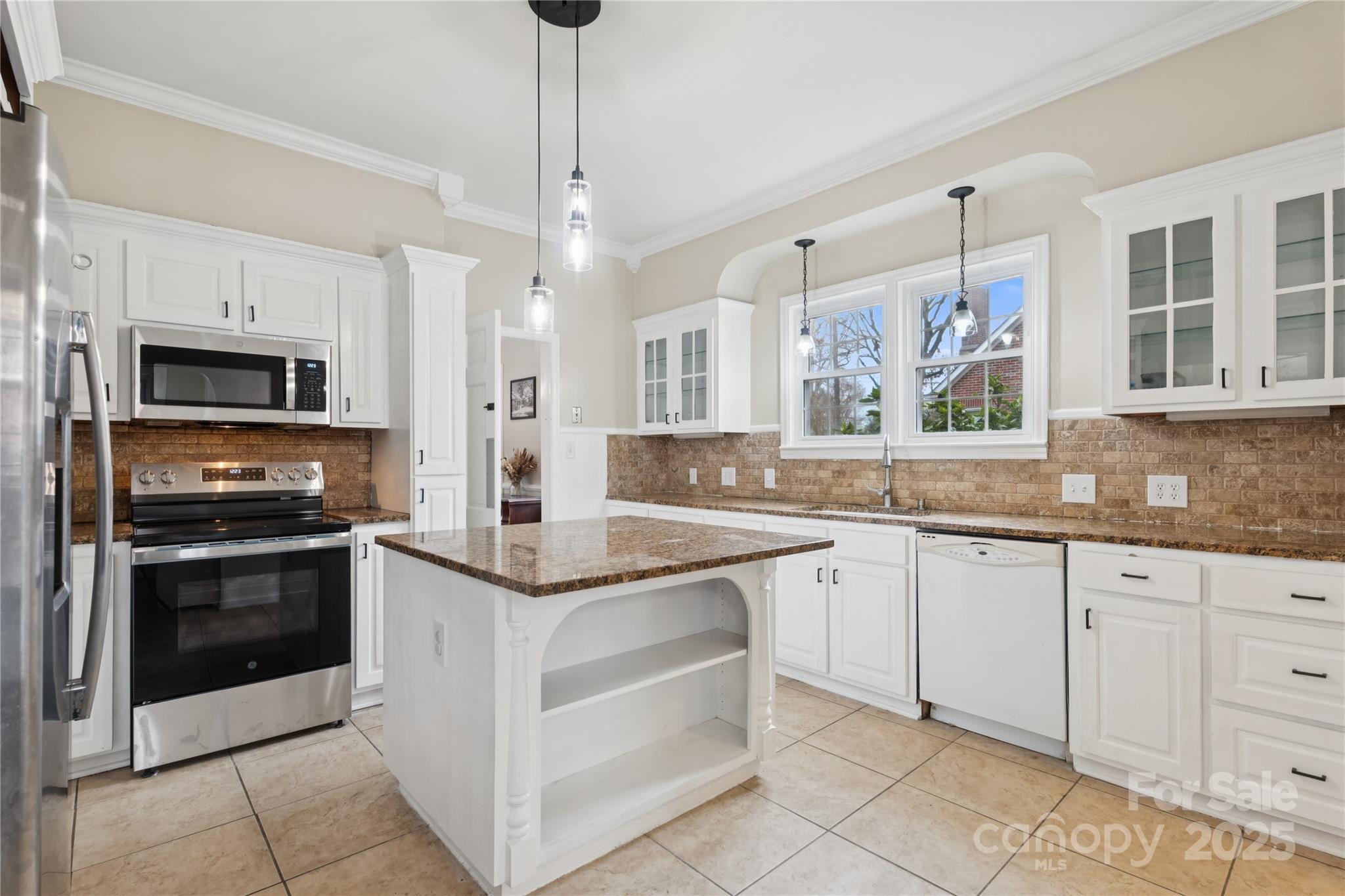 514 West Barr Street Lancaster, SC 29720 - Photo 14 of 36 a kitchen with stainless steel appliances granite countertop a stove and a sink