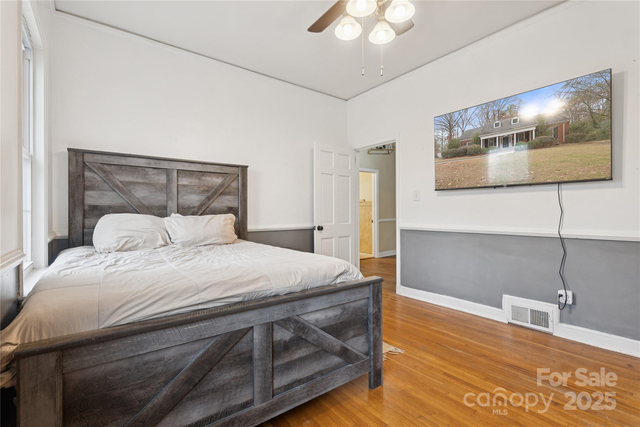 514 West Barr Street Lancaster, SC 29720 - Photo 20 of 36 a bedroom with a bed and a night stand