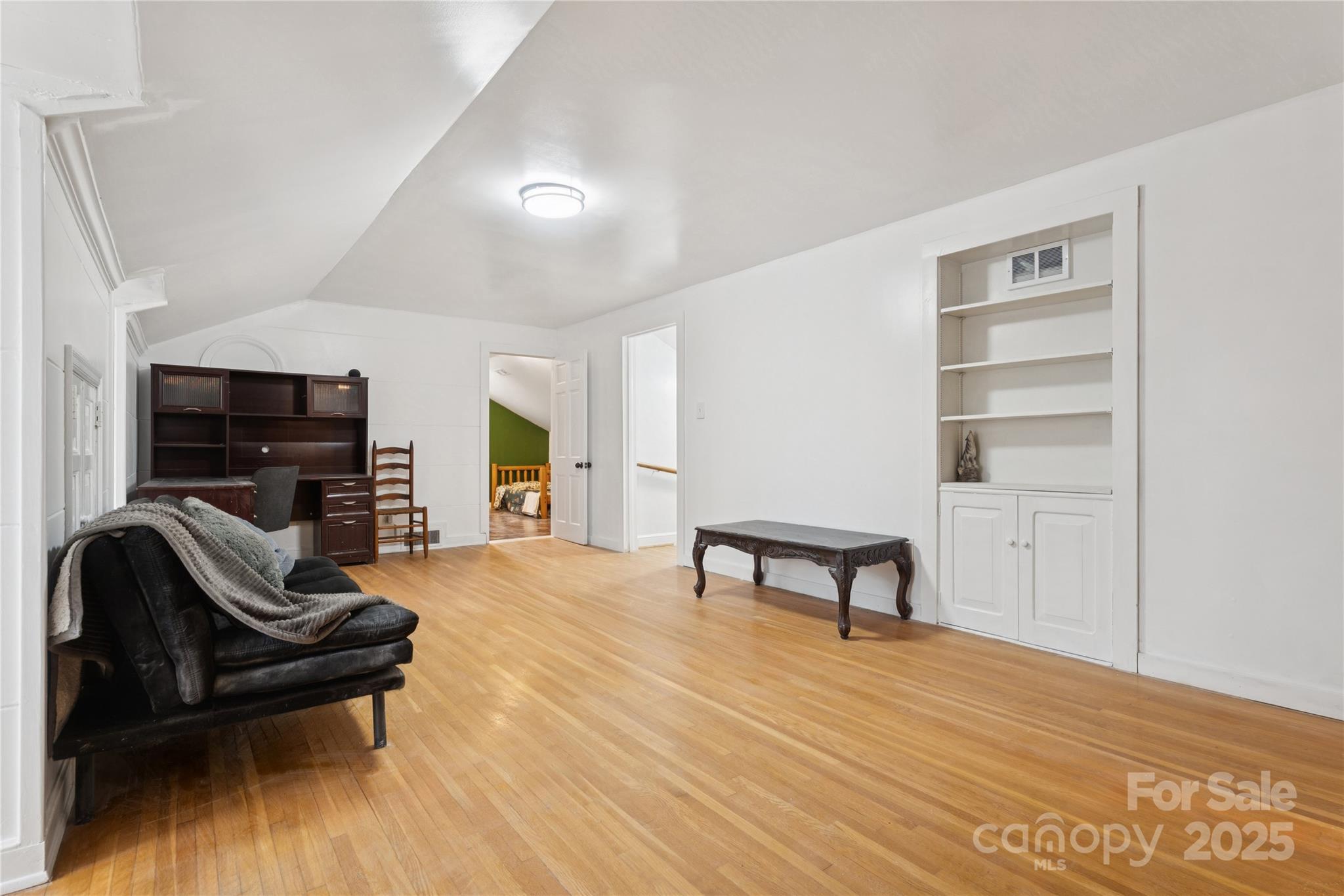 514 West Barr Street Lancaster, SC 29720 - Photo 26 of 36 a living room with furniture and a wooden floor