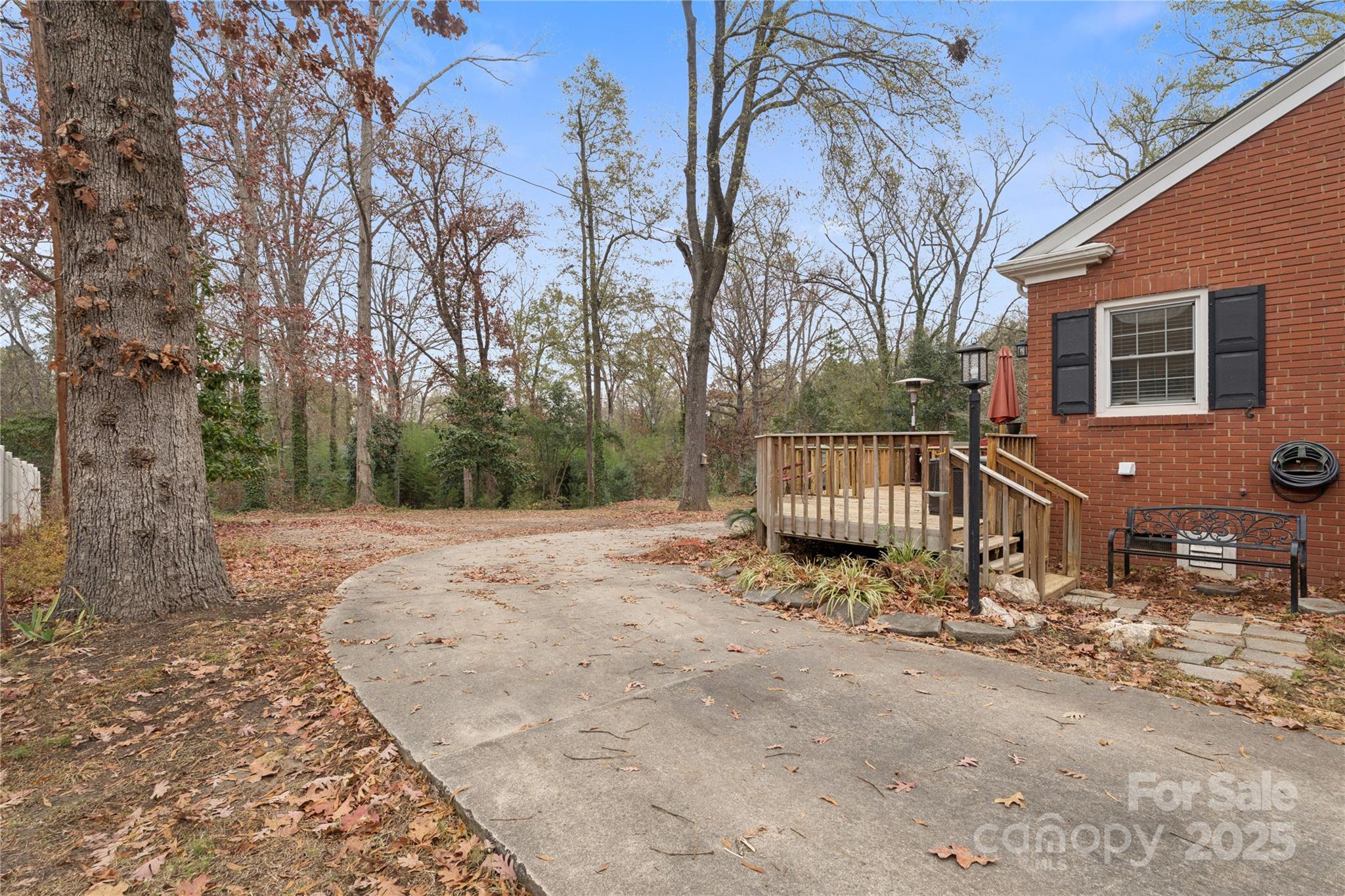 514 West Barr Street Lancaster, SC 29720 - Photo 3 of 36 a pathway of a house with a yard covered in snow