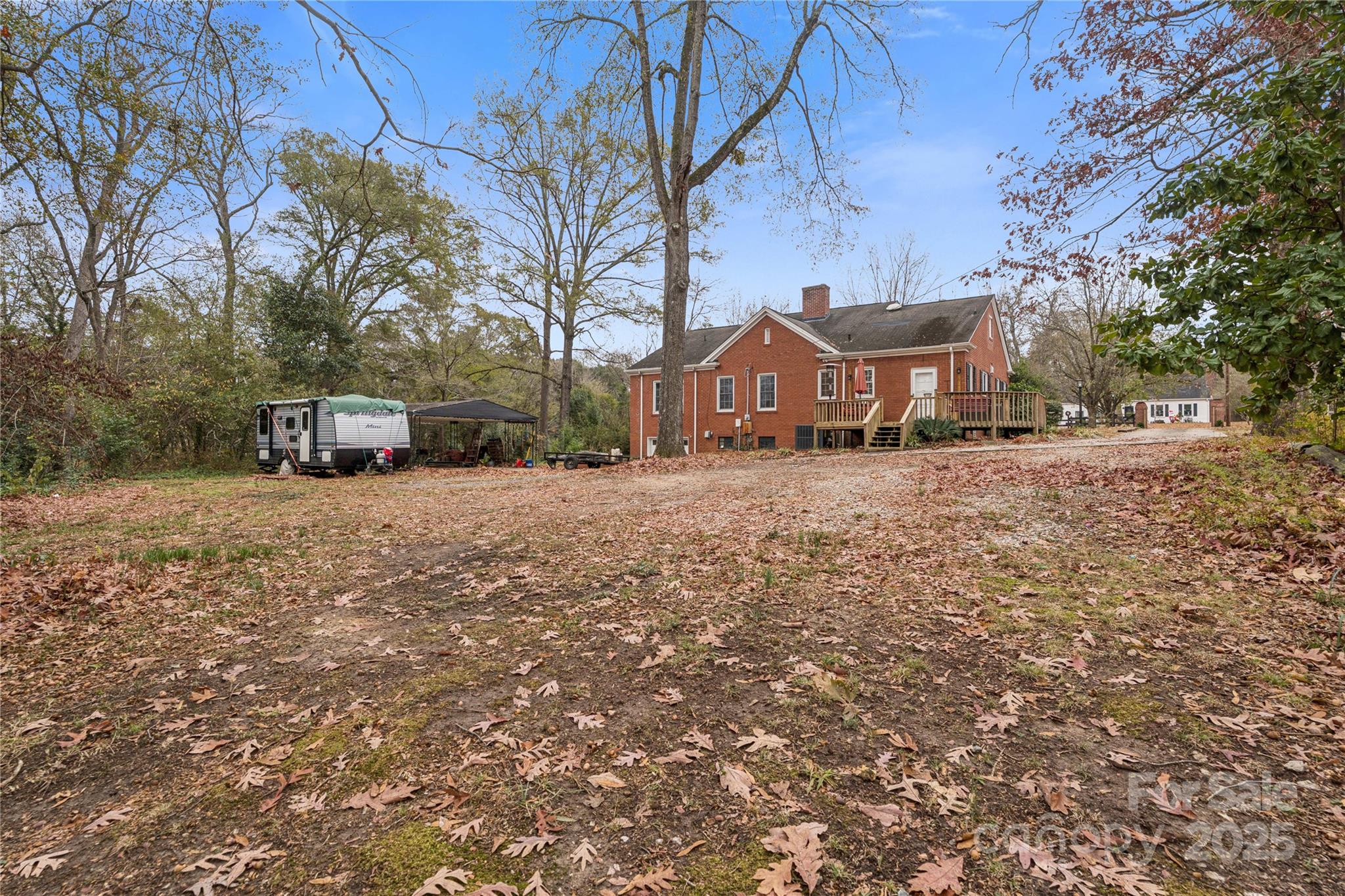 514 West Barr Street Lancaster, SC 29720 - Photo 35 of 36 a view of a house with a yard covered in snow