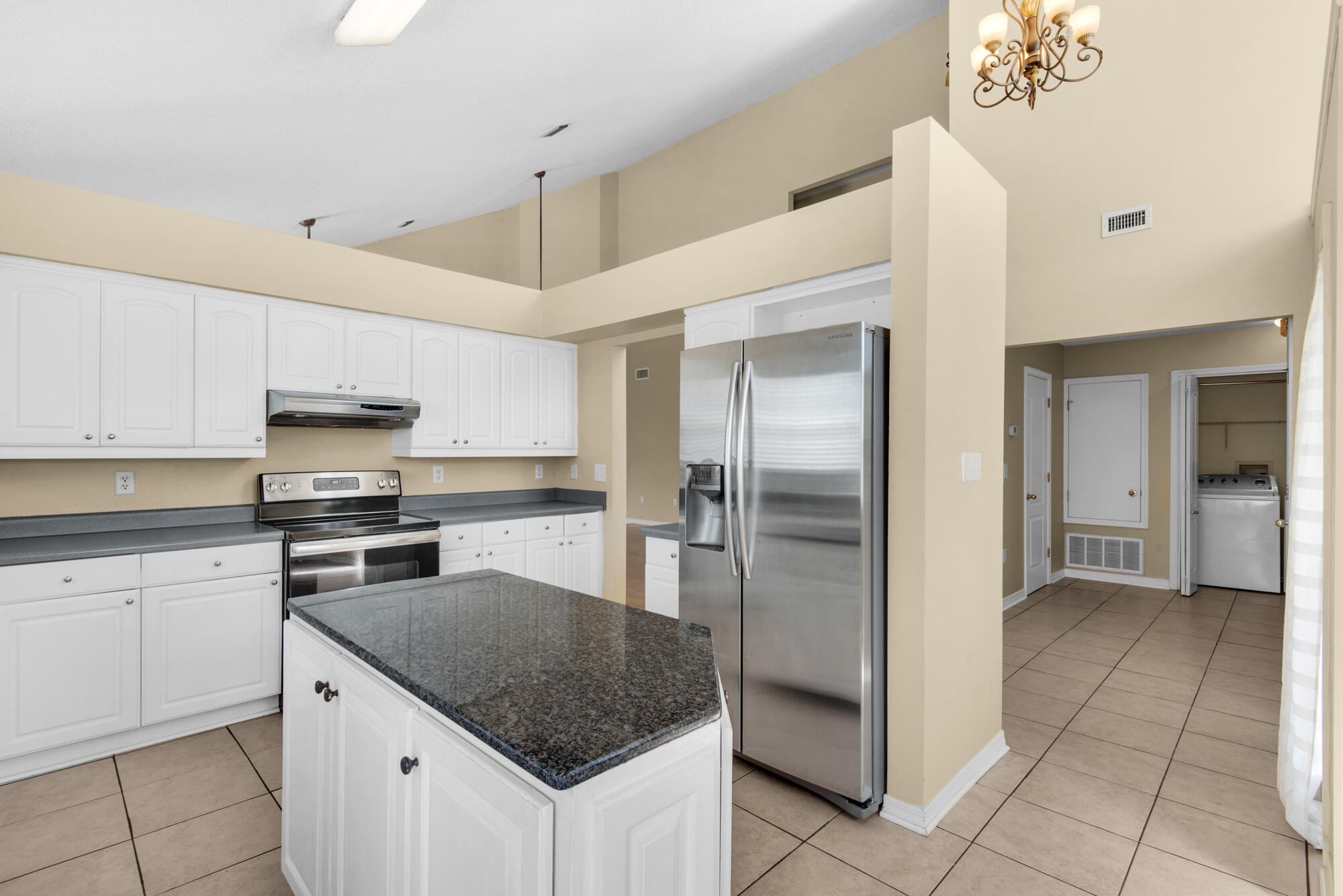 880 Brande Court Shalimar, FL 32579 - Photo 16 of 57 a kitchen with kitchen island granite countertop a refrigerator oven a sink and dishwasher