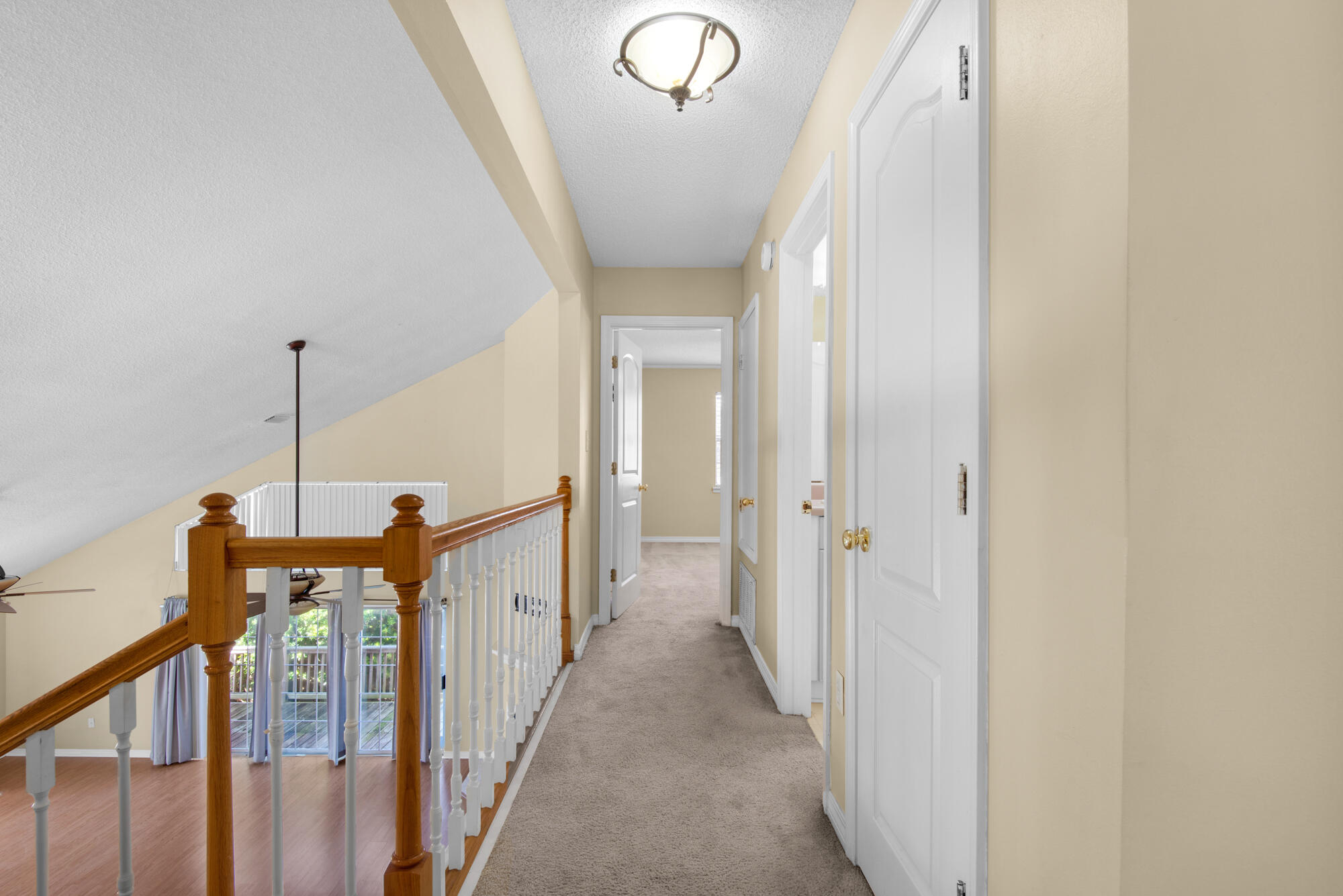 880 Brande Court Shalimar, FL 32579 - Photo 28 of 57 a view of a hallway with windows