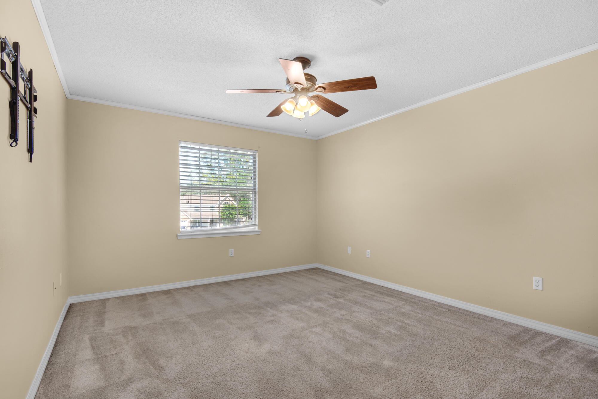 880 Brande Court Shalimar, FL 32579 - Photo 29 of 57 an empty room with a window and a fan