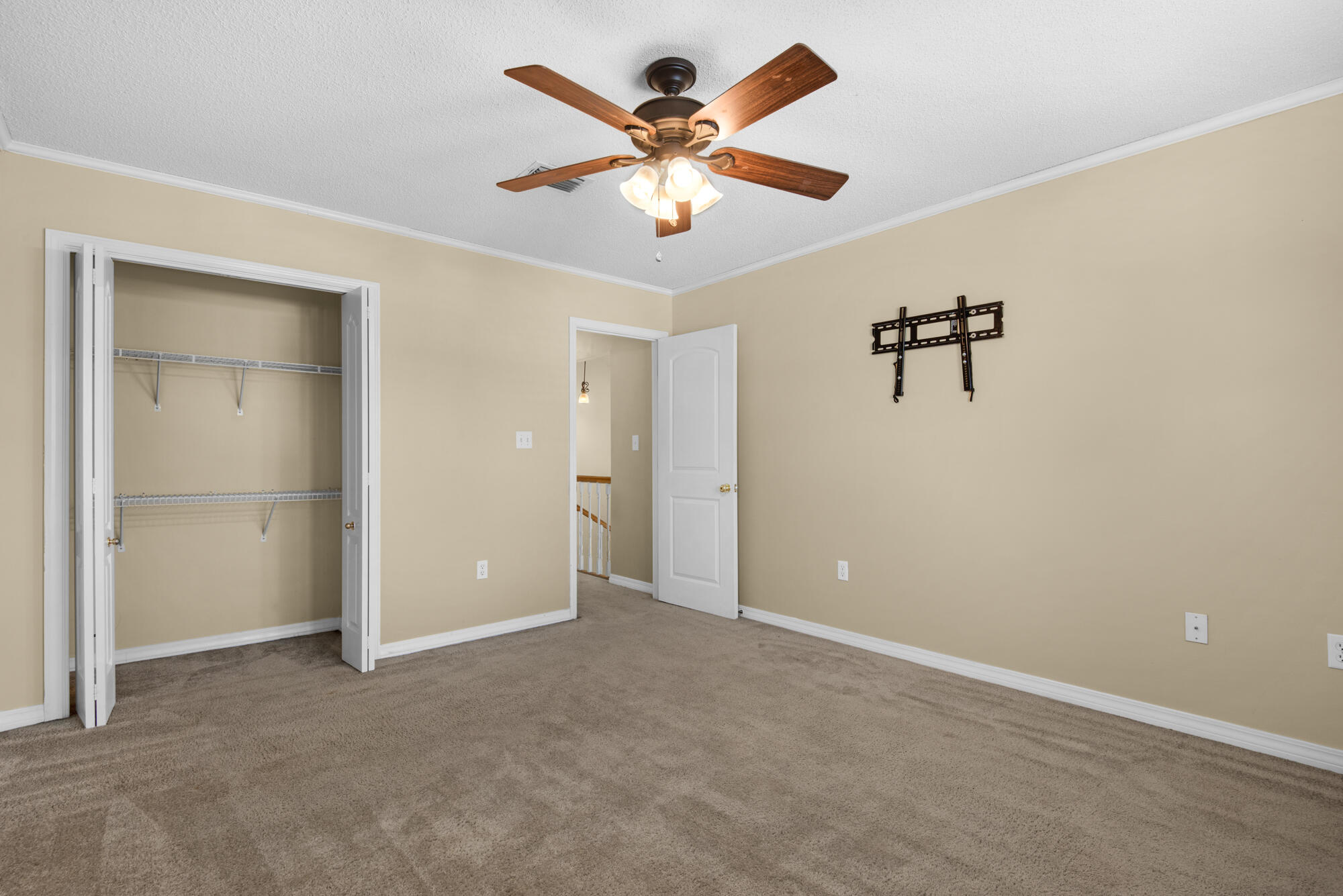 880 Brande Court Shalimar, FL 32579 - Photo 30 of 57 an empty room with closet and fan