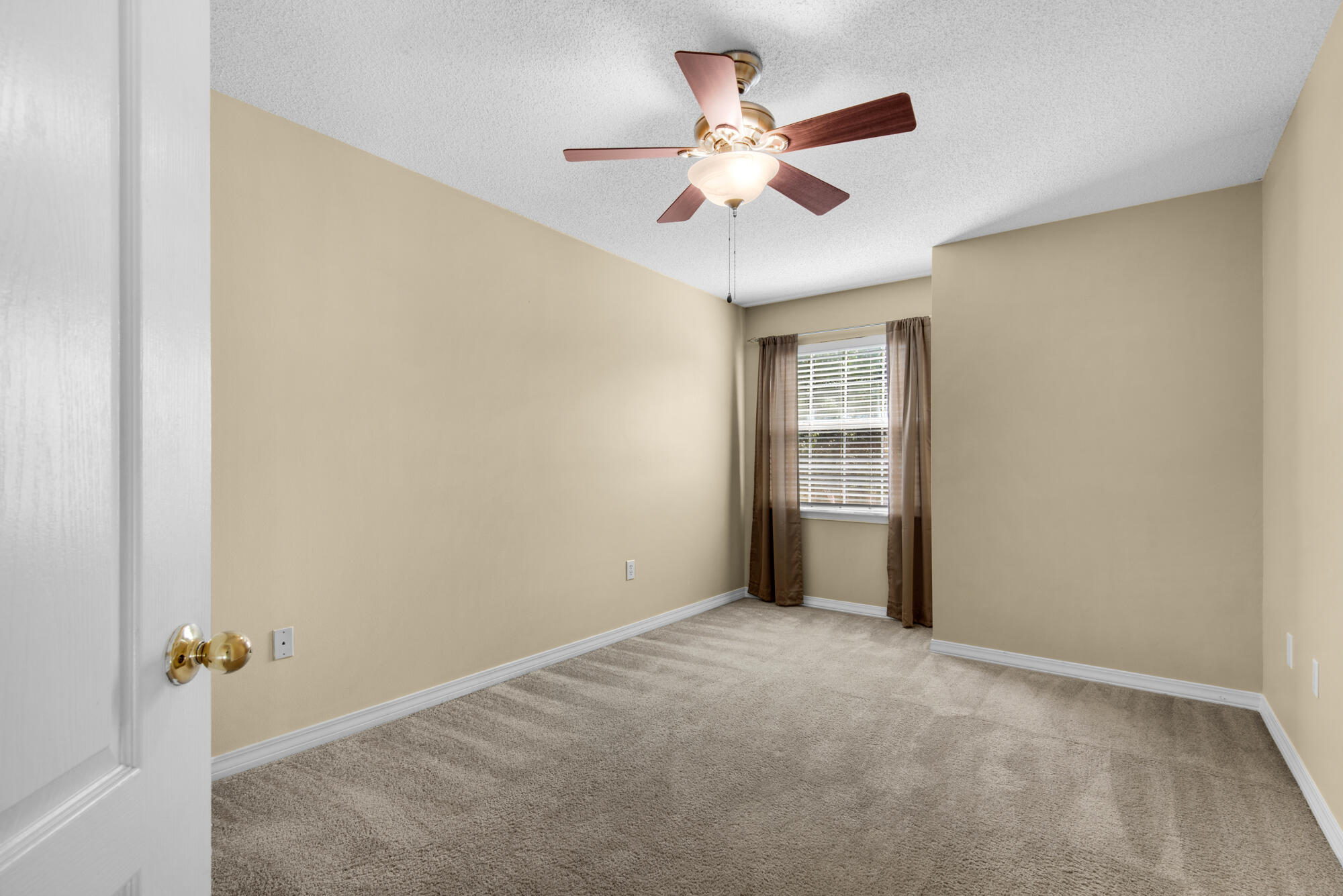 880 Brande Court Shalimar, FL 32579 - Photo 36 of 57 an empty room with closet and fan