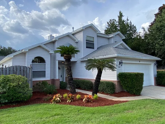 a view of a swimming pool with a outdoor seating