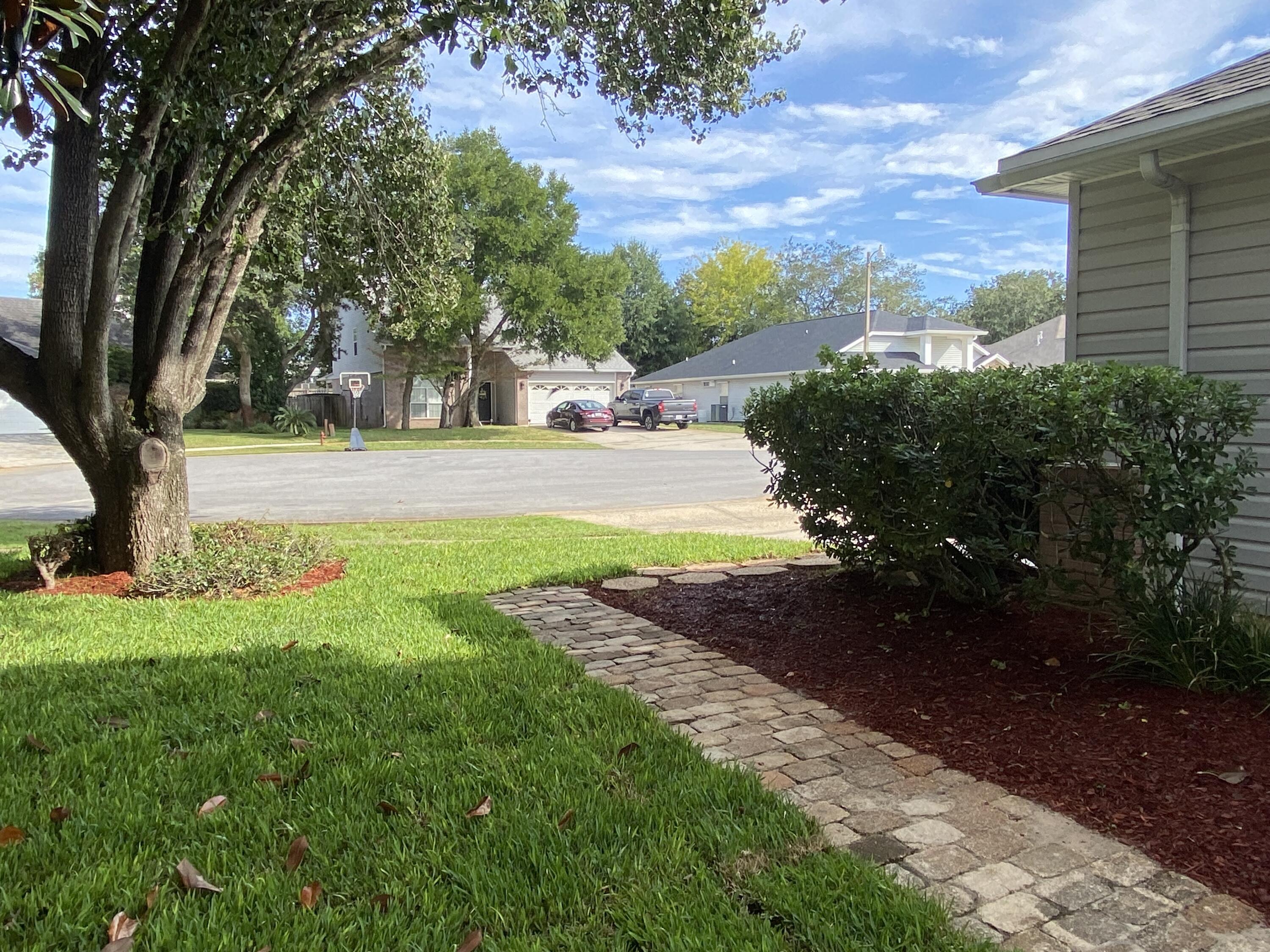 880 Brande Court Shalimar, FL 32579 - Photo 39 of 57 a view of yard with tree