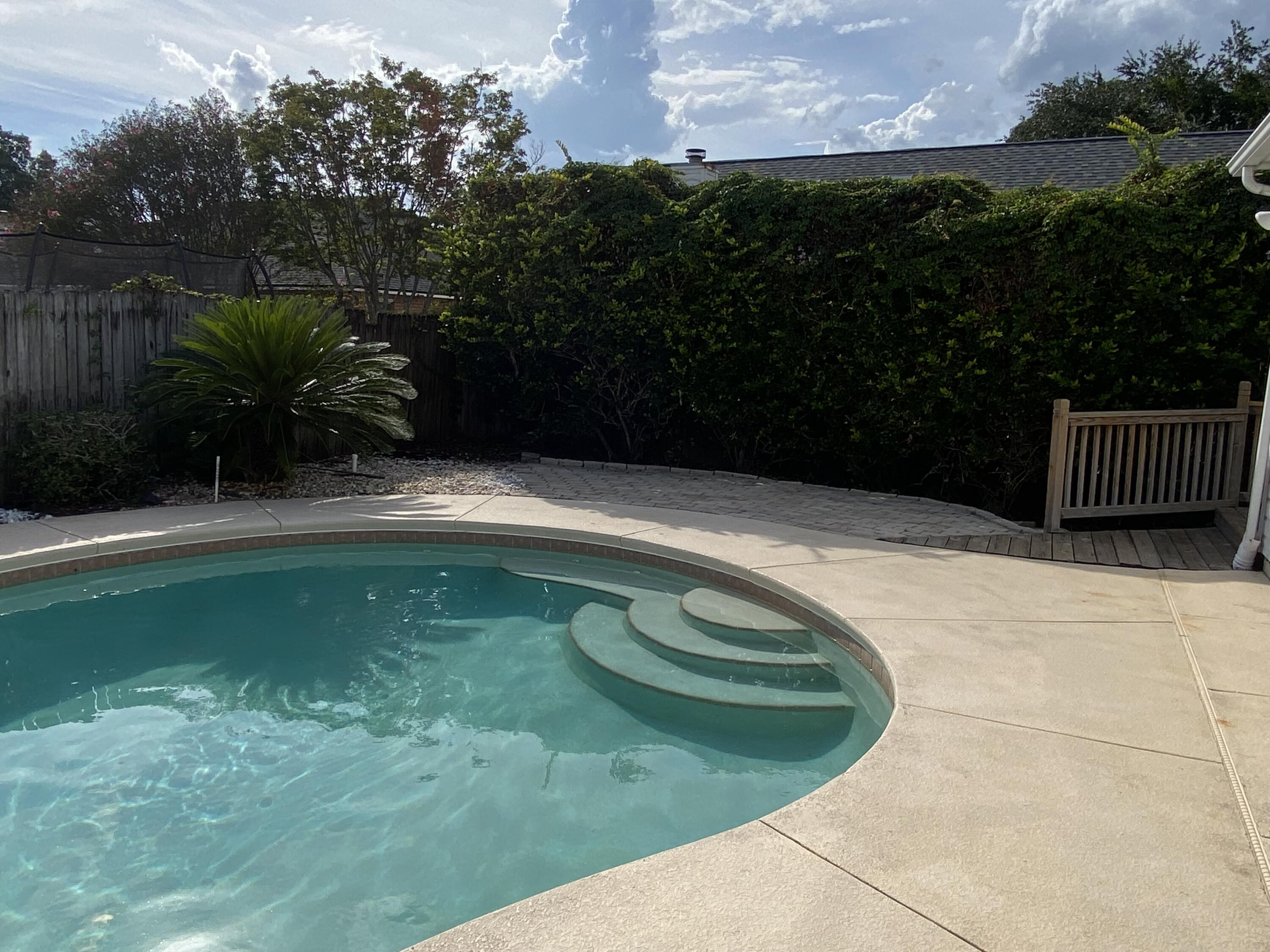880 Brande Court Shalimar, FL 32579 - Photo 41 of 57 a view of a swimming pool with a outdoor seating