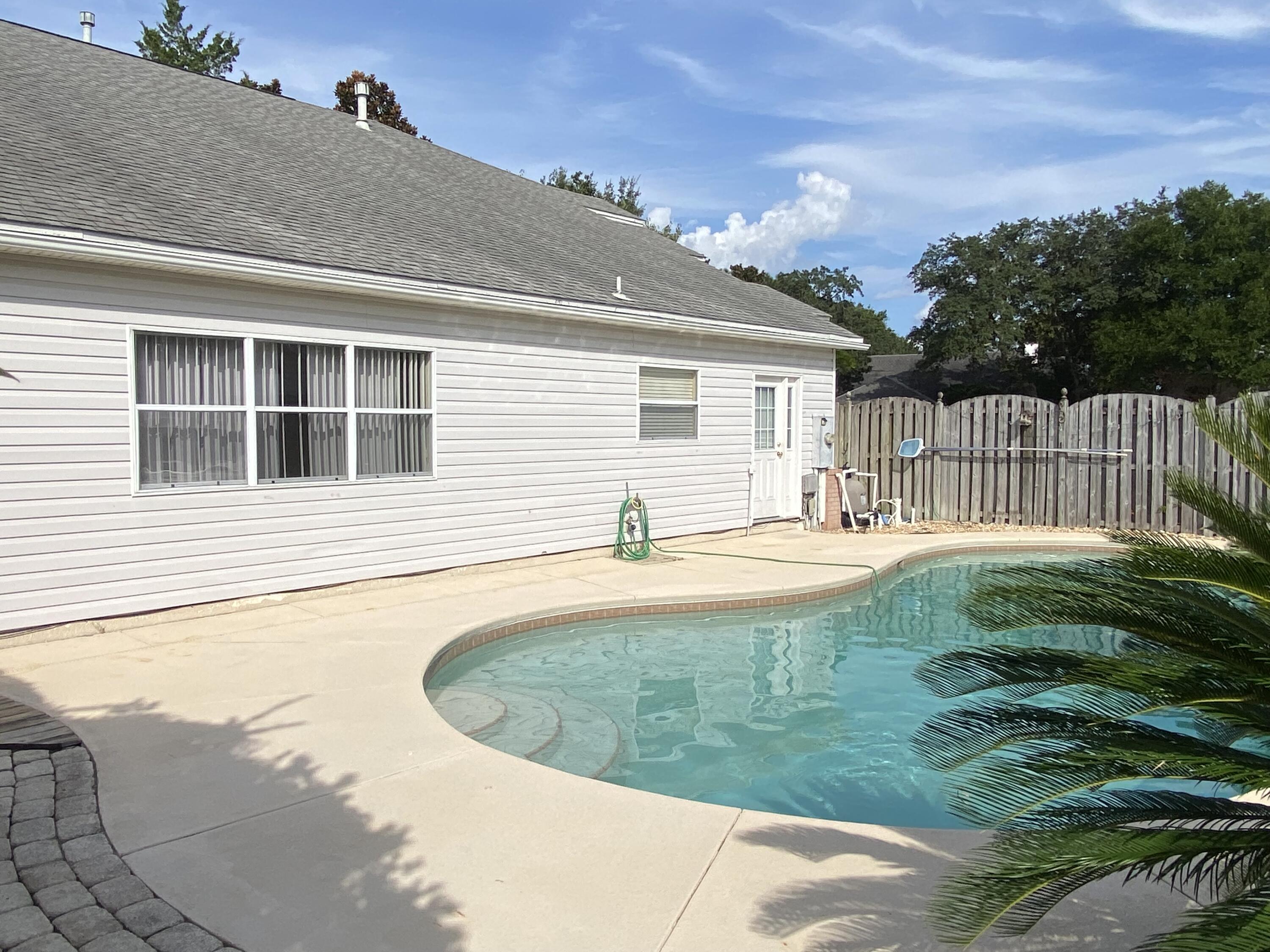 880 Brande Court Shalimar, FL 32579 - Photo 46 of 57 a view of a house with backyard and sitting area