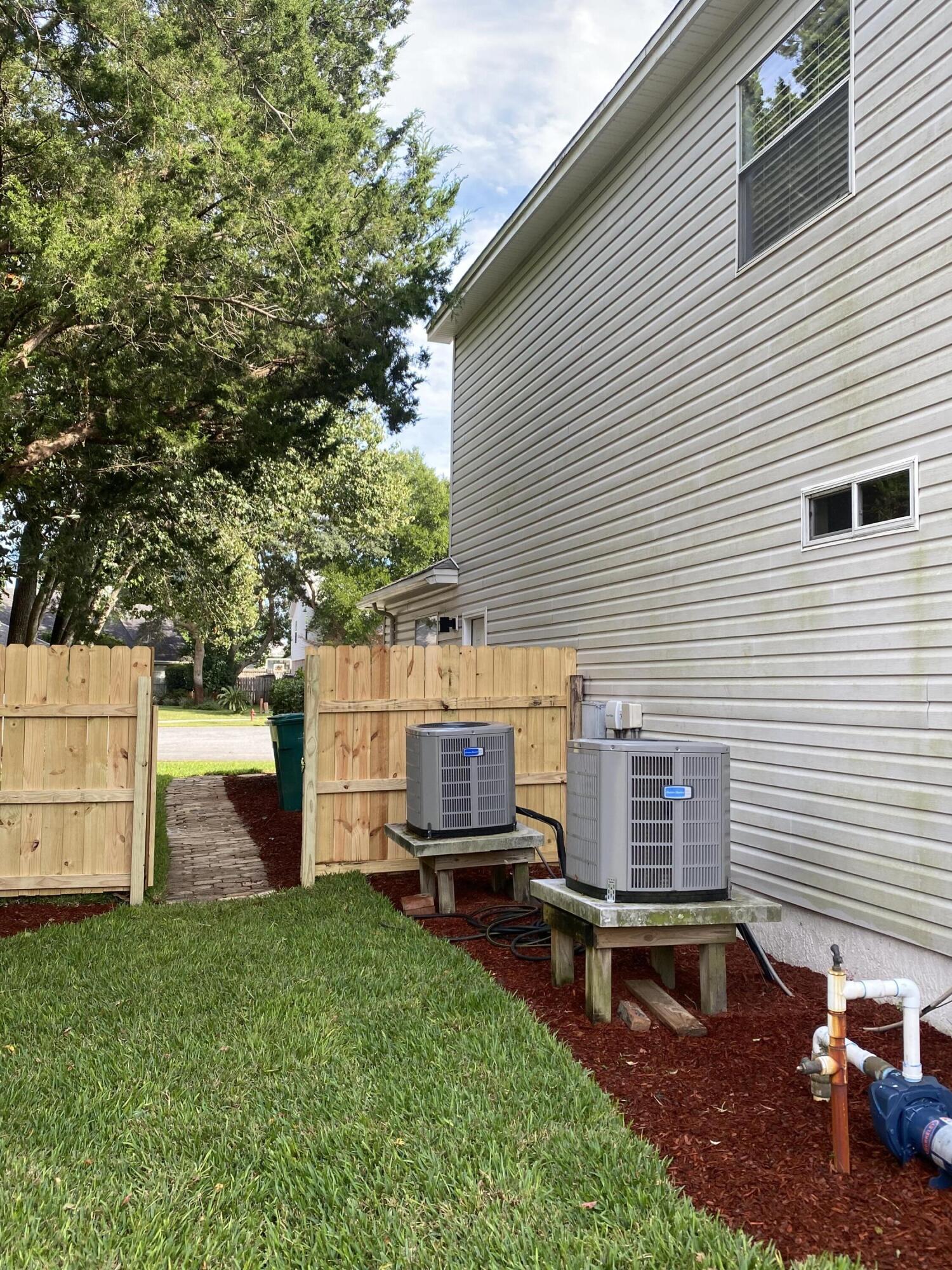 880 Brande Court Shalimar, FL 32579 - Photo 49 of 57 a view of a backyard with a garden