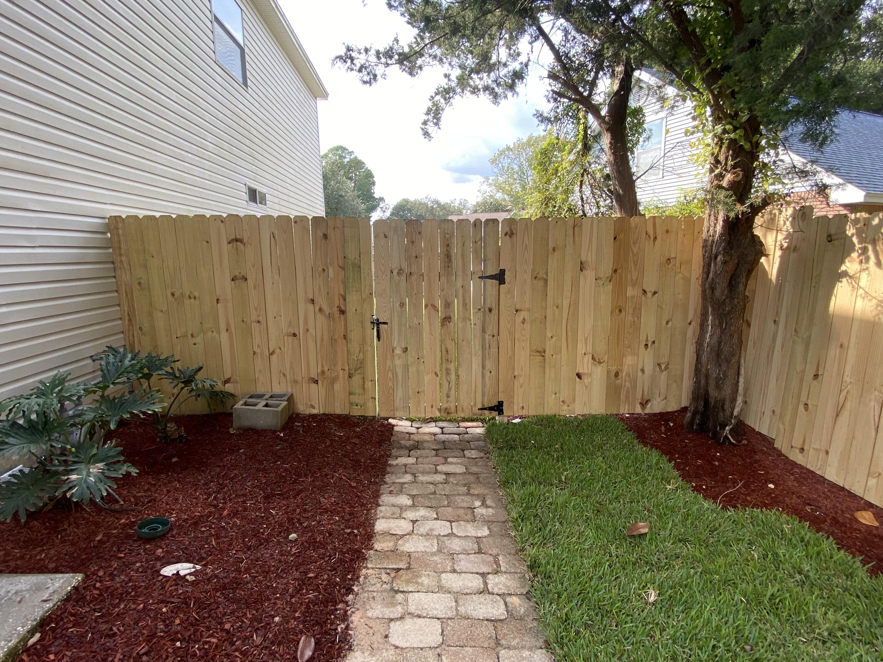 880 Brande Court Shalimar, FL 32579 - Photo 52 of 57 a view of a backyard with pathway