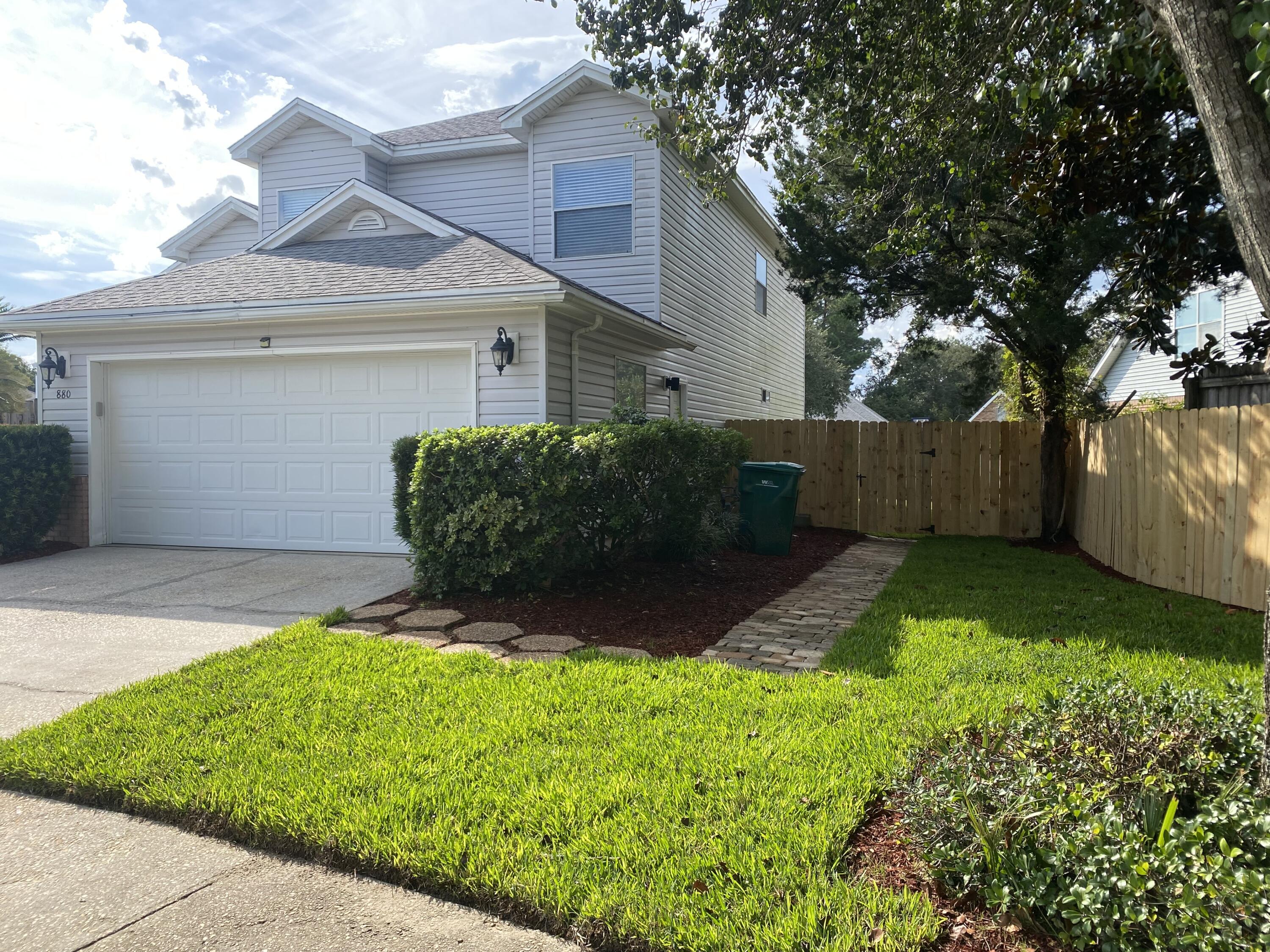 880 Brande Court Shalimar, FL 32579 - Photo 55 of 57 a front view of a house with garden