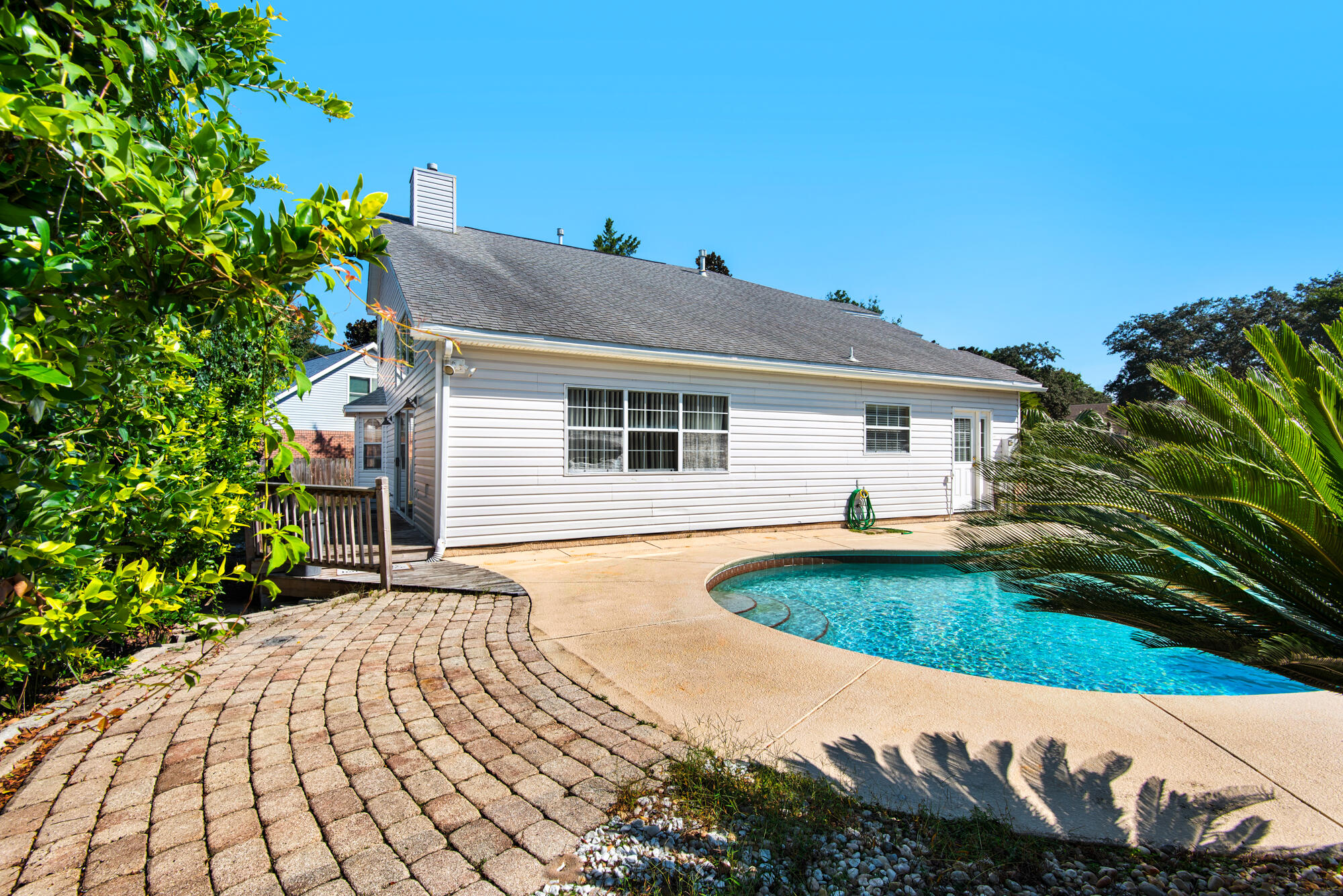 880 Brande Court Shalimar, FL 32579 - Photo 6 of 57 a front view of a house with garden