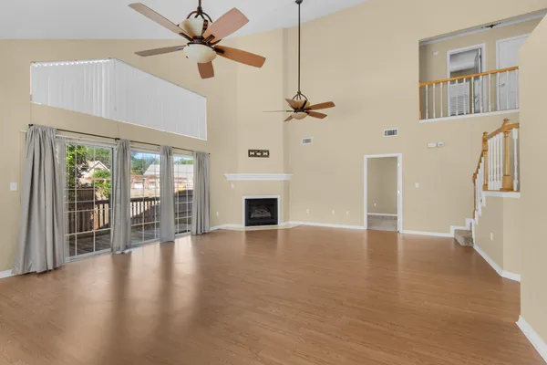 a view of an entryway with wooden floor