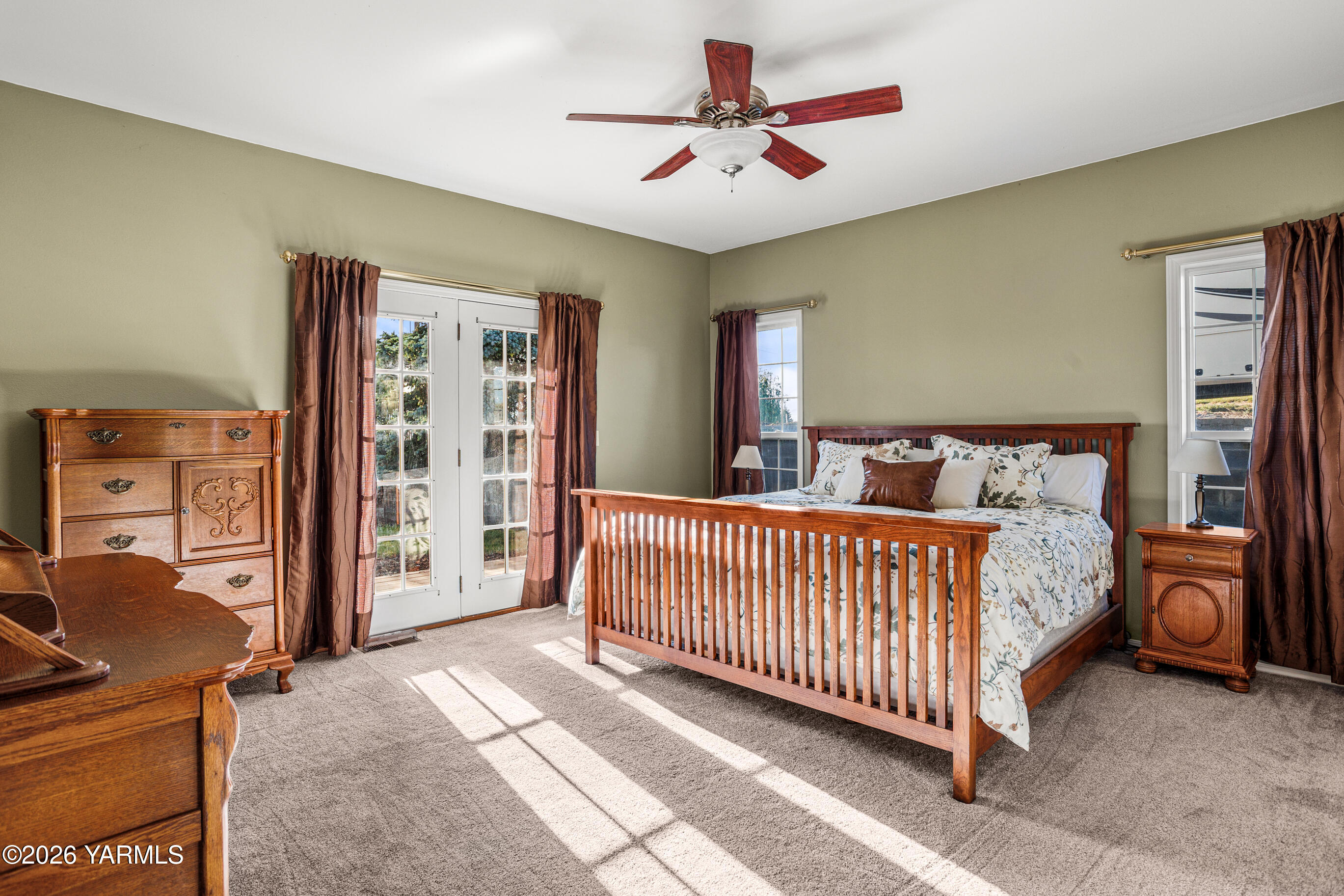 5060 Lombard Loop Road Zillah, WA 98953 - Photo 30 of 65 a bed room with a bed and a chandelier