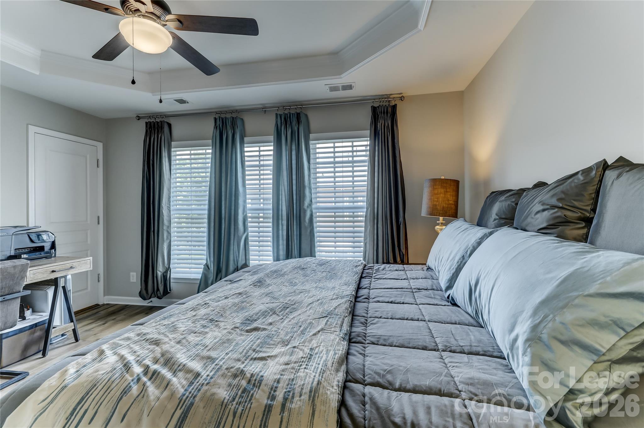 905 Lyndley Drive Fort Mill, SC 29708 - Photo 34 of 42 a bedroom with a large bed and a chandelier