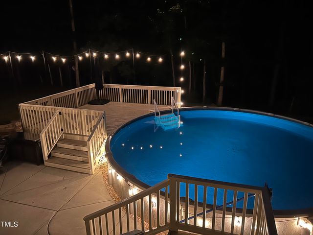 a front view of a house with swing and slide