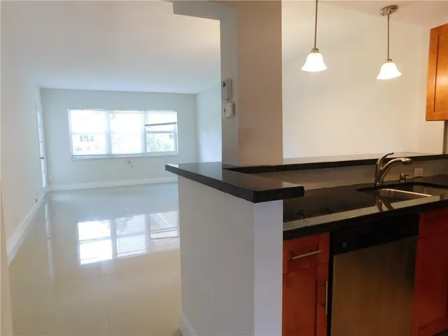 a kitchen with a sink and a window