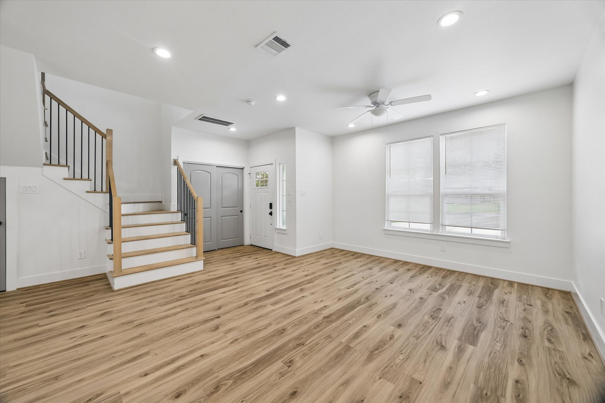 2749 Redrock Street, Unit B Houston, TX 77088 - Photo 5 of 24 The living area features recessed lighting, a ceiling fan with light fixture, windows with blinds & plenty of natural light.