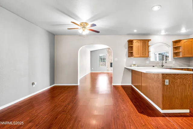 a view of an empty room and a window