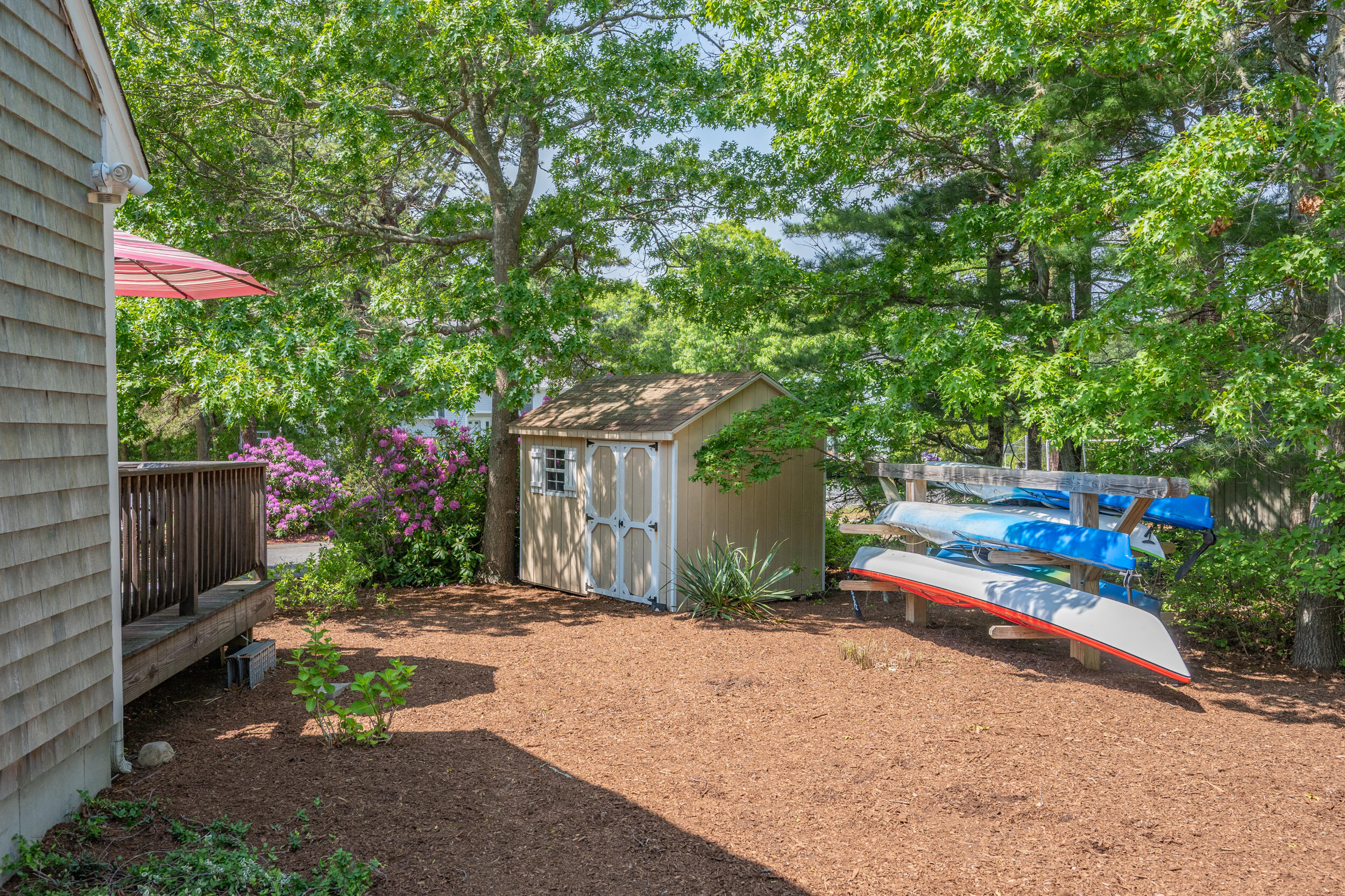 64 Manitoba Road Mashpee, MA 02649 - Photo 16 of 26 64 Manitoba Road - Side Yard