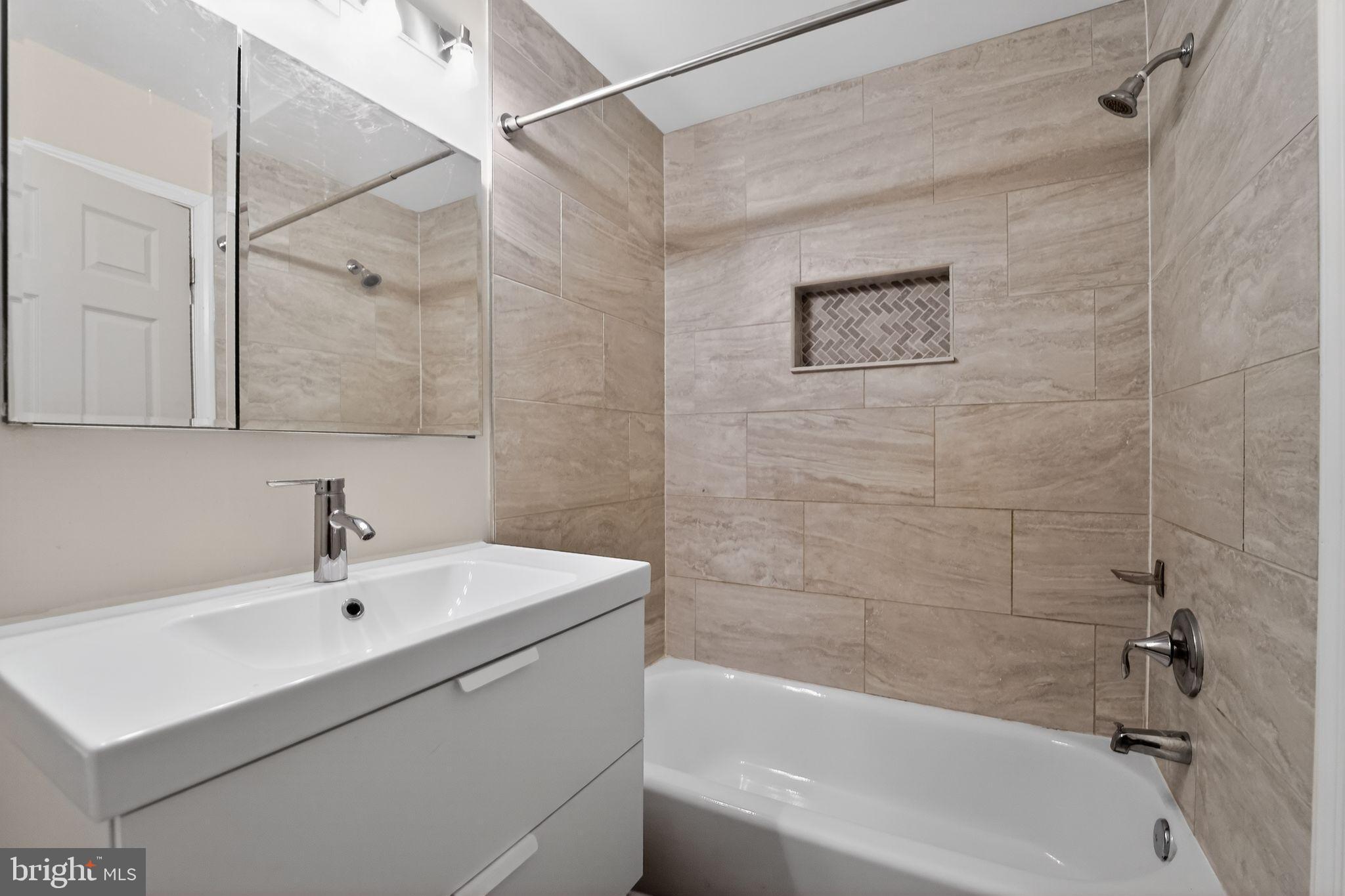 1602 Latrobe Street Baltimore, MD 21202 - Photo 15 of 15 Sleek modern bathroom with elegant finishes.