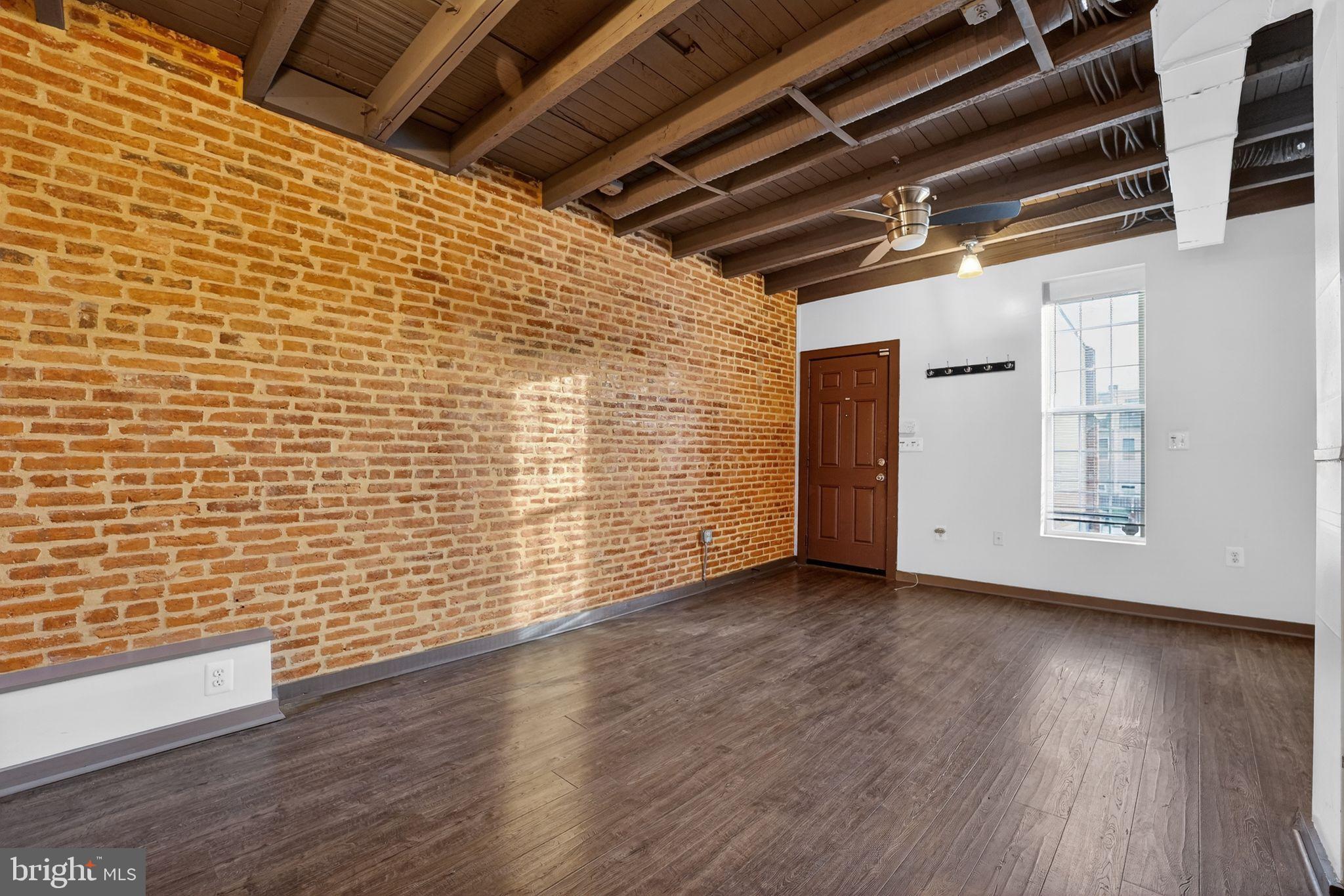 1602 Latrobe Street Baltimore, MD 21202 - Photo 4 of 15 Charming space with exposed brick accents.