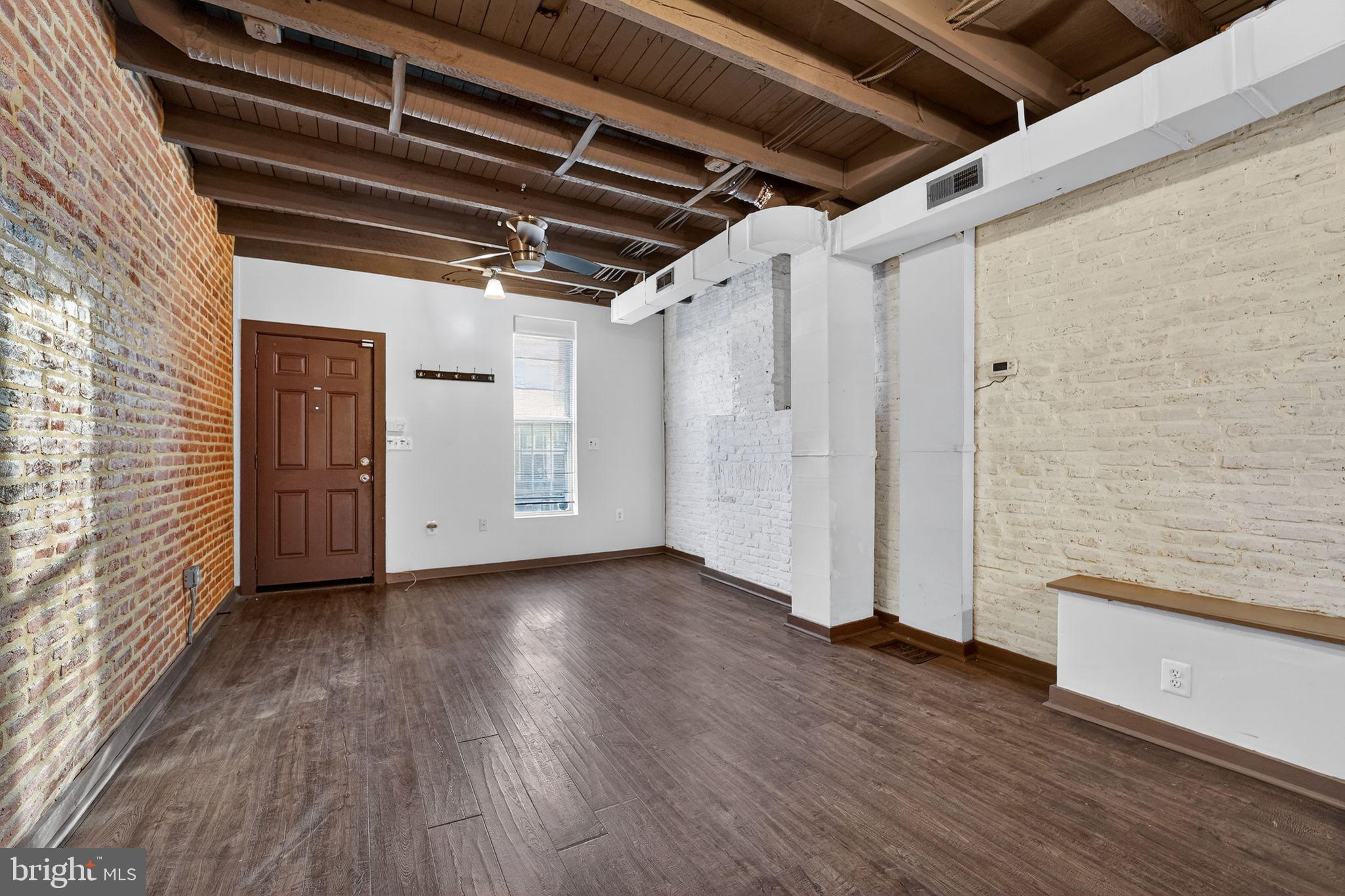 1602 Latrobe Street Baltimore, MD 21202 - Photo 5 of 15 Charming urban loft with exposed brick walls.