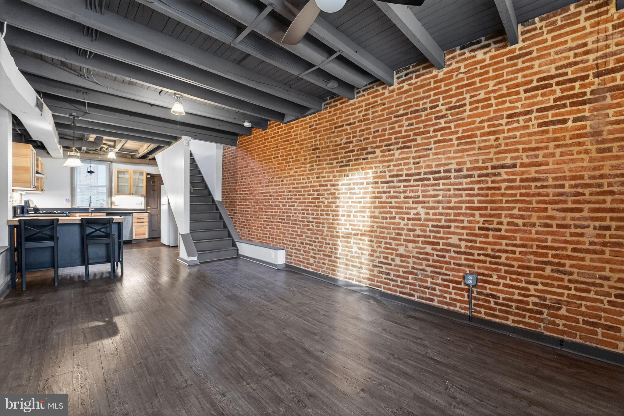 1602 Latrobe Street Baltimore, MD 21202 - Photo 6 of 15 Charming loft with exposed brick and beams.