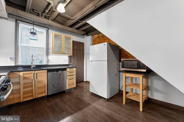 a very nice looking room with wooden floor and a window
