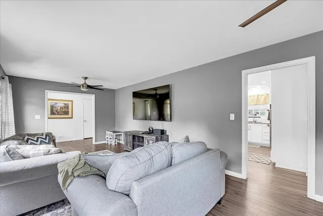 a large kitchen with stainless steel appliances granite countertop a stove a sink and a refrigerator