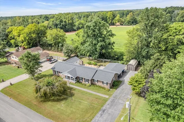 a view of a swimming pool with a yard
