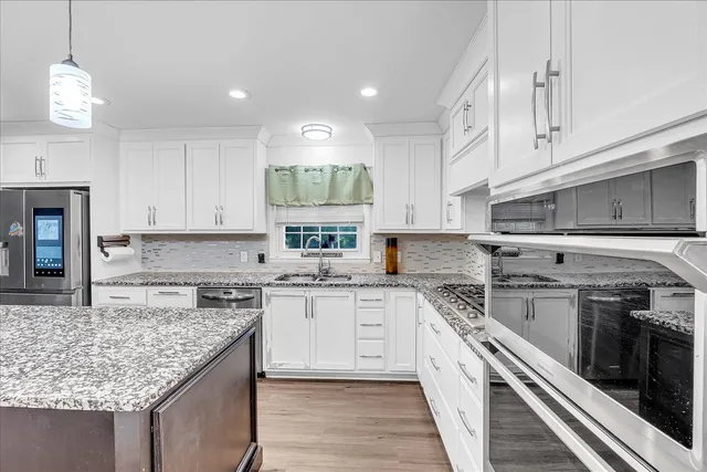 a view of a livingroom with furniture and a fireplace