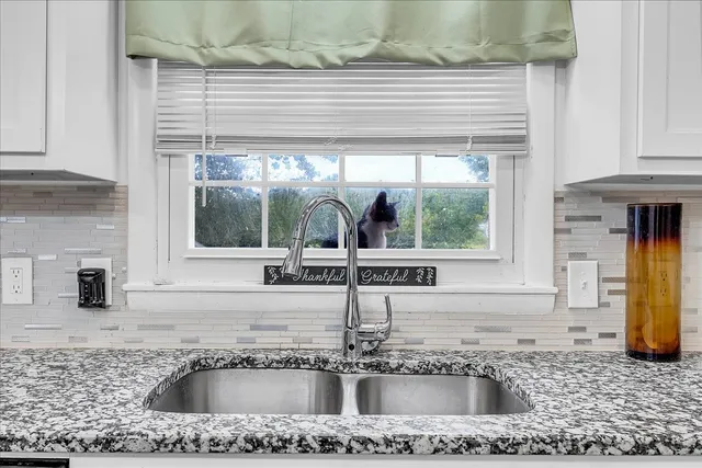 a bathroom with a sink and mirror