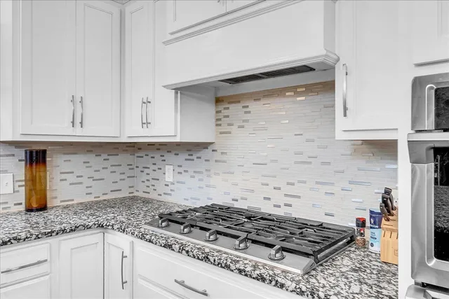 a spacious bedroom with a bed and a window