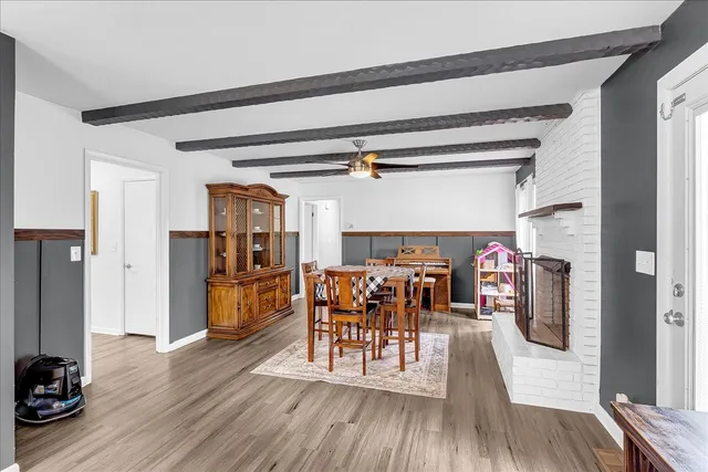 a spacious bathroom with a granite countertop tub sink and mirror