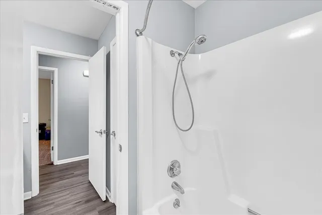 a view of a livingroom with workspace and a window