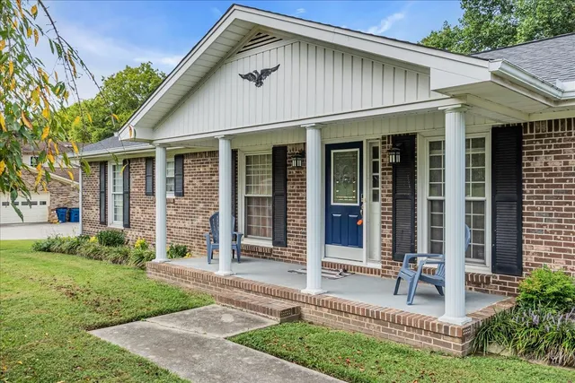 a view of a garden with a bench in a garden