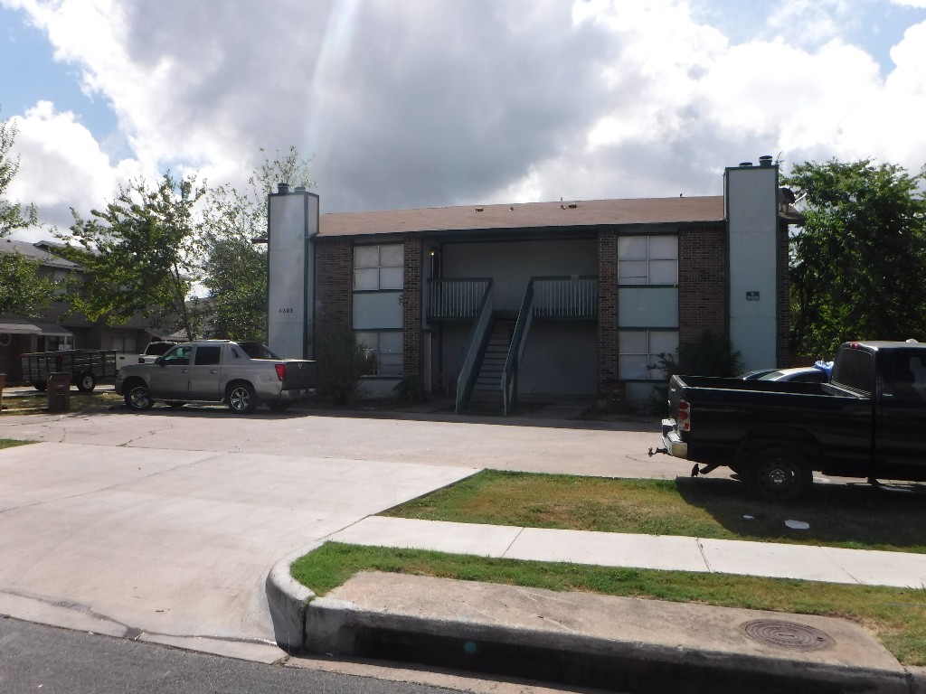 a view of house with yard