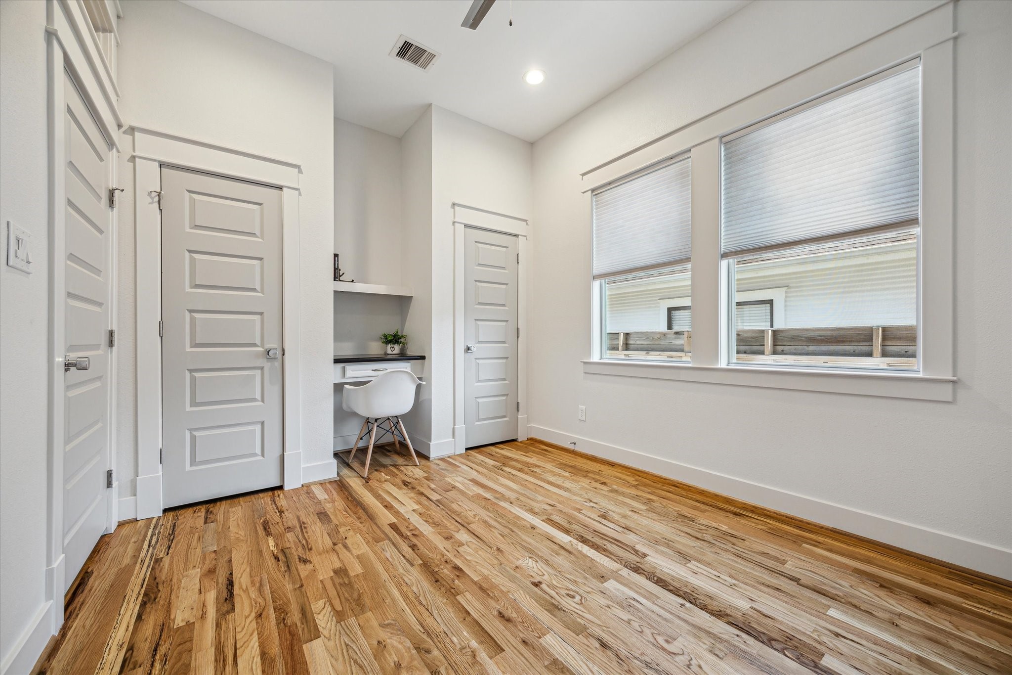 1833 Tabor Street Houston, TX 77009 - Photo 19 of 28 Secondary bedroom with dual closets and built in desk - perfect for work, study or creative projects