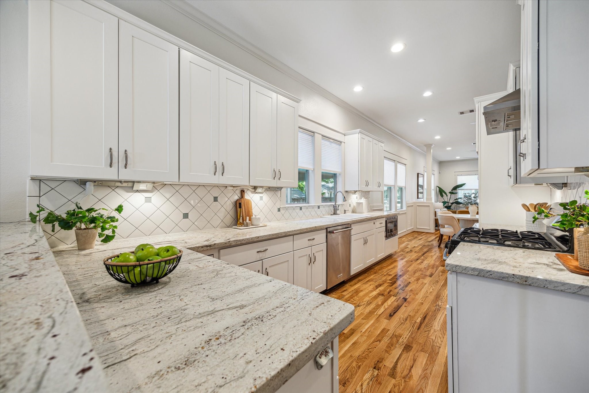 1833 Tabor Street Houston, TX 77009 - Photo 10 of 28 Bright and spacious kitchen with quartz countertops, ample cabinetry and a generous workspace for all your culinary adventures.