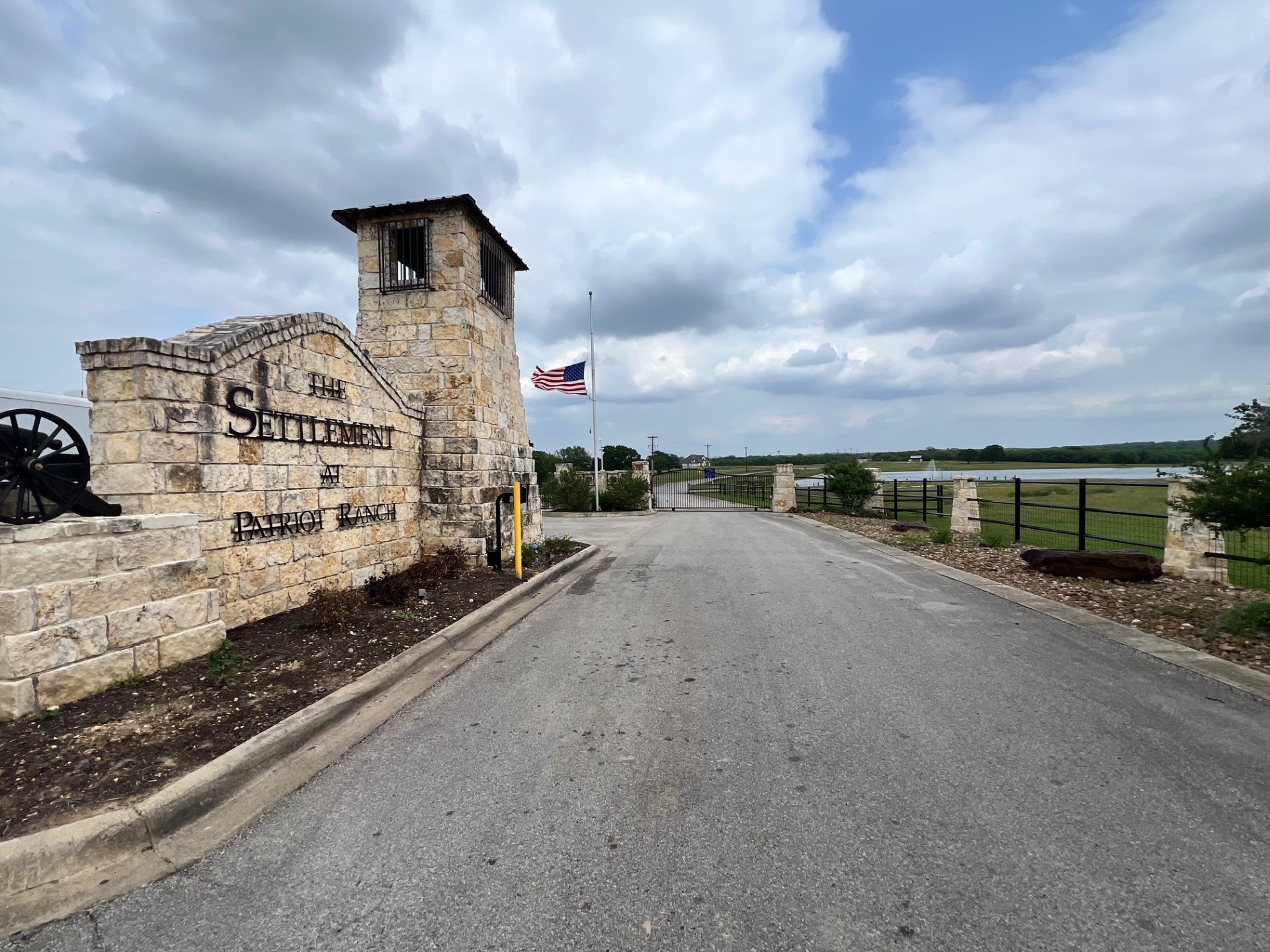 Lot 17 Settlement Way Luling, TX 78648 - Photo 13 of 14 Stone gateway welcomes you to "The Settlement at Patriot Ranch," featuring a gated entry.