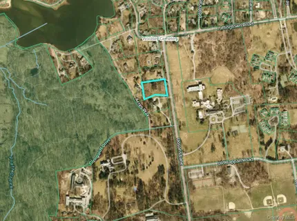 view of a balcony with table and chairs